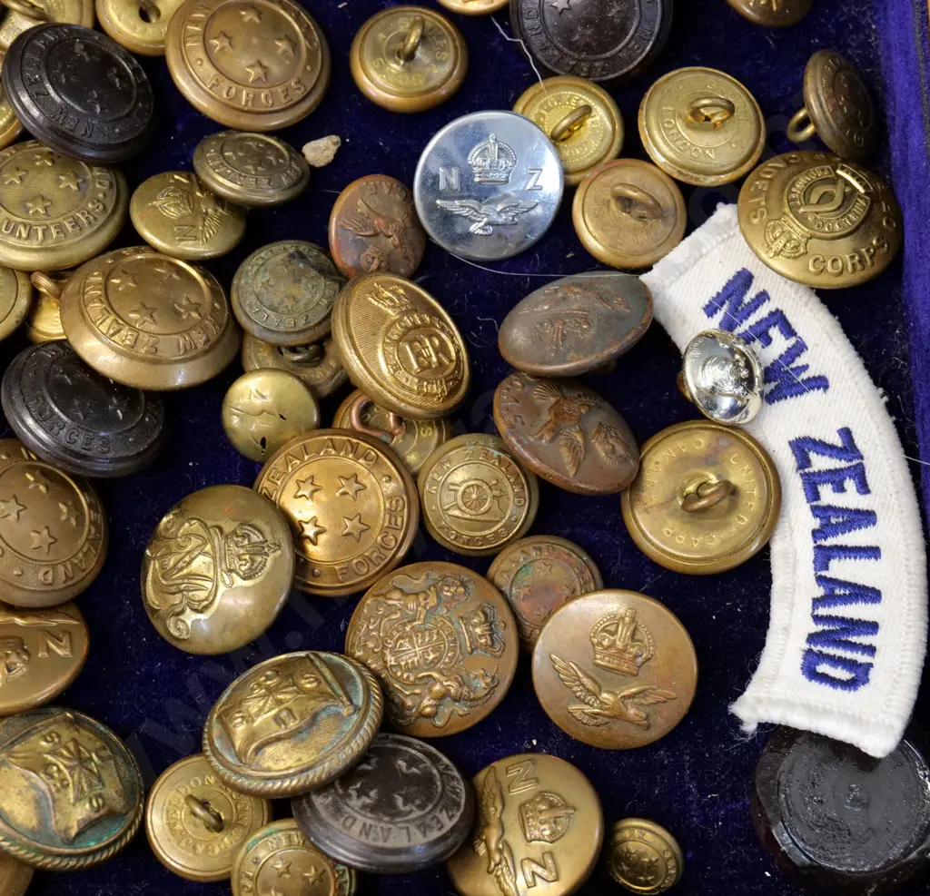 large assortment of brass & other military or uniform buttons - NZ, Australia, Canada etc on velvet lined wooden box lid Image 1++
