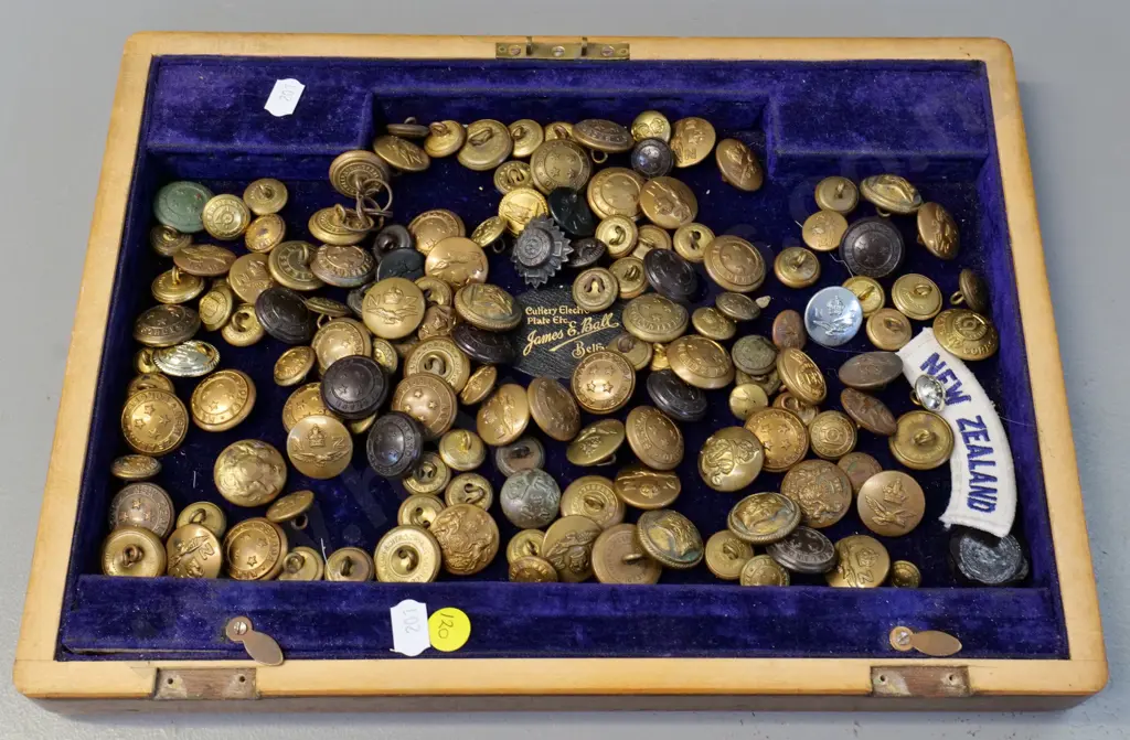 large assortment of brass & other military or uniform buttons - NZ, Australia, Canada etc on velvet lined wooden box lid Image 1++