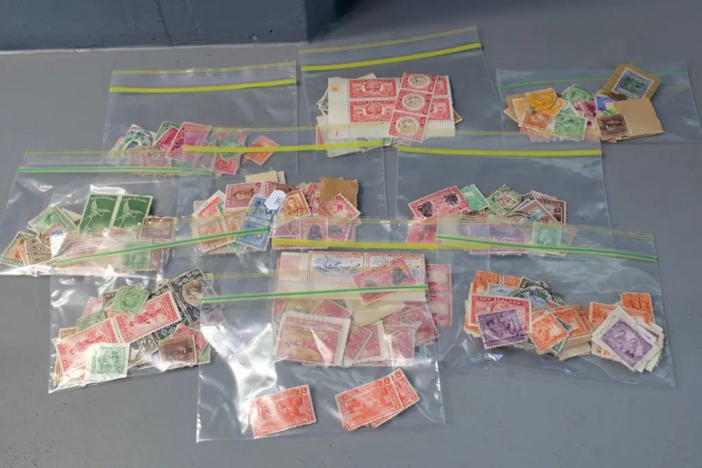 11 small packets of vintage New Zealand stamps, including 1930s Health stamps, most used but some not Image 1++