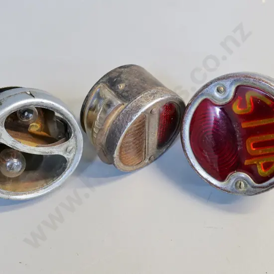 3 vintage automotive tail lights - Brown Bi-Lite with "Stop" lens, one missing lens - largest is Diameter 115