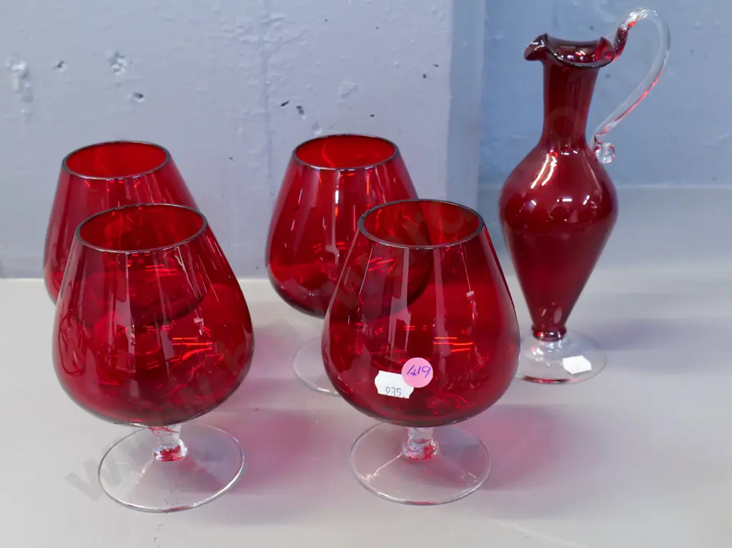 4 ruby glass on clear stem brandy balloons & a ruby glass jug with clear base and handle H210 Image 1++