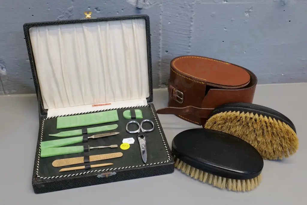retro cased English nail set and leather-cased pair of ebony hair brushes Image 1++