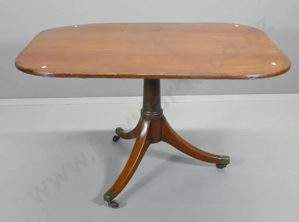 vintage mahogany oblong loo table - tripod base, cross-banded edge, metal casters, some lifting veneer H710 L1210 W900 Image 1++