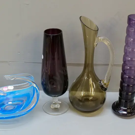 4 coloured glass items - heavy art glass blue & clear bowl, 2 vases and a jug/vase - tall purple vase is H-300
