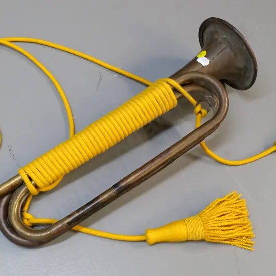 vintage Slingerland brass bugle with yellow cord - some dents and a crack L-450