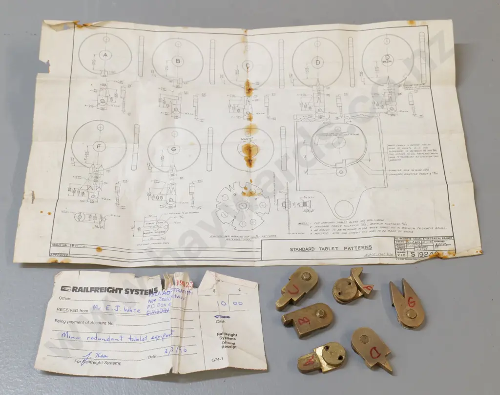 set of 6 shaped brass Tyer's Tablet Machine patterns that fit notch in tablets, with purchase receipt from NZR Dunedin Image 1++