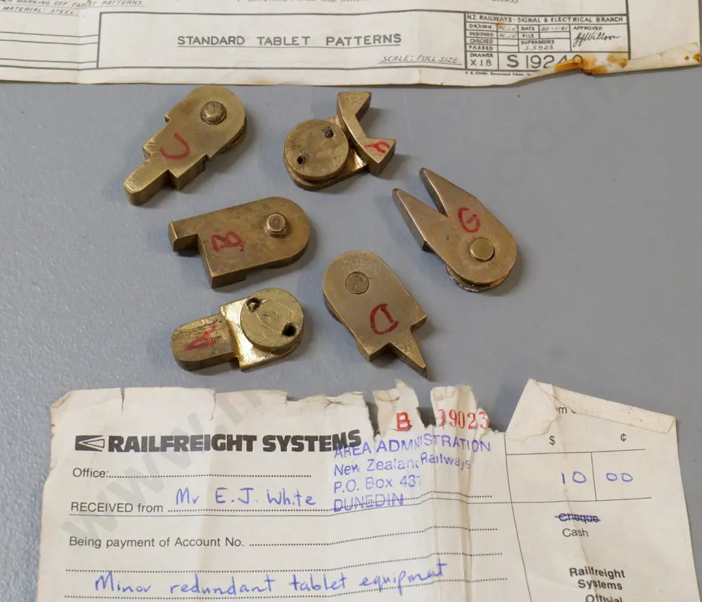 set of 6 shaped brass Tyer's Tablet Machine patterns that fit notch in tablets, with purchase receipt from NZR Dunedin Image 1++