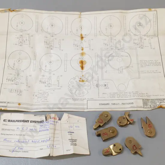 set of 6 shaped brass Tyer's Tablet Machine patterns that fit notch in tablets, with purchase receipt from NZR Dunedin
