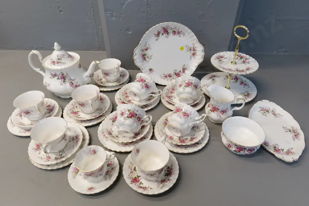 large collection of Royal Albert Lavender Rose pattern tea-ware including teapot, 8 trios, cake stand etc. Image 1++