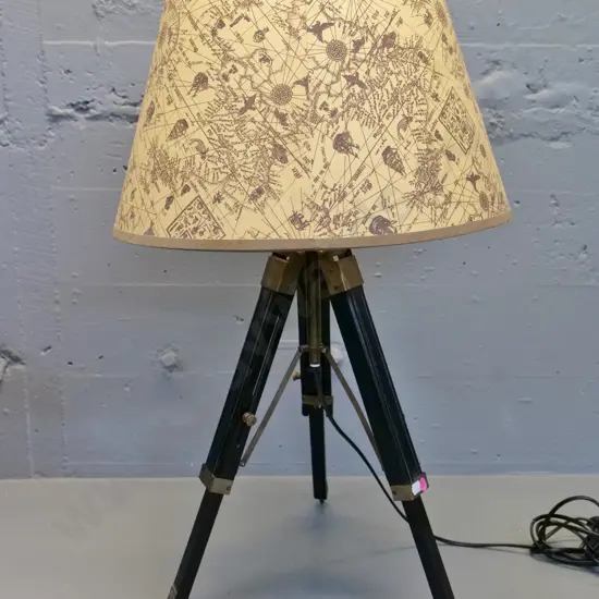 reproduction timber tripod table lamp with brass fittings, antique motif shade H700 D410