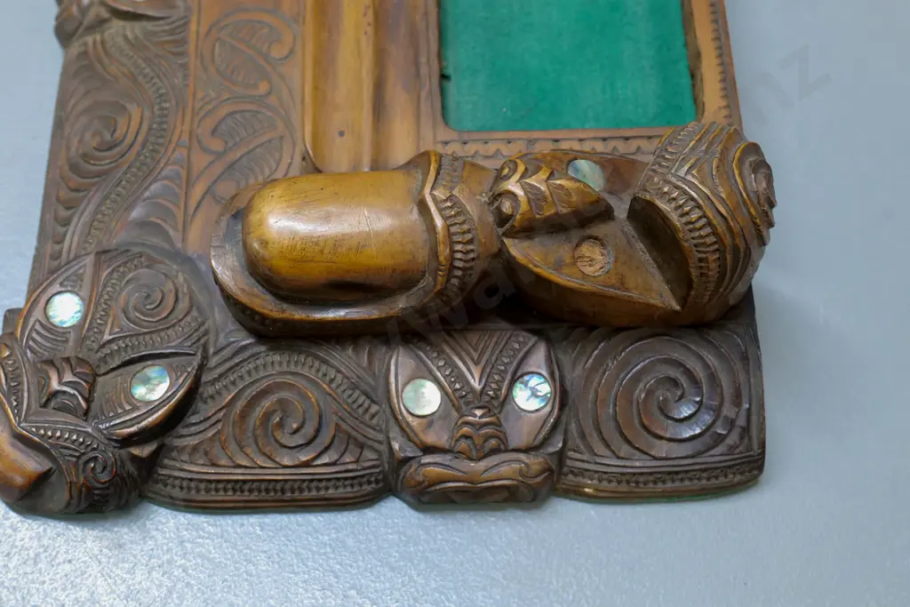 ornately carved Maori-motif desk organiser with paua insets - one missing - minor cracking W-360 D-220 Image 1++