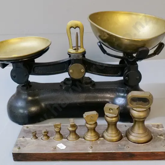 cast iron and brass balance scales - no maker's marks - with a graduated set of weights on wooden holder. Scales W320