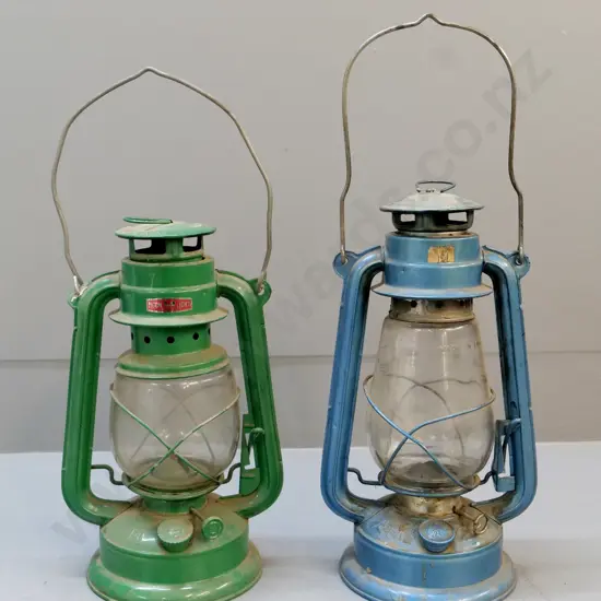 2 kerosene lamps - made in China, one has 'Moonlight' label. Blue one slightly taller H-320