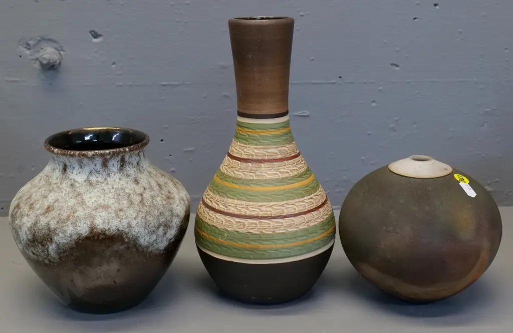 3 pottery vases - 2 German, taller is H-260, and a globe shaped hand-potted raku vase, unknown mark on base Image 1++