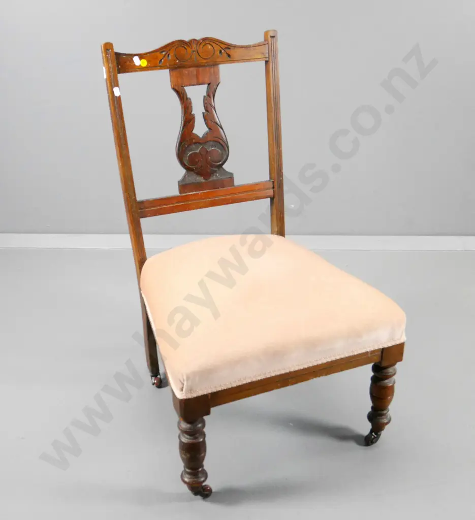 Edwardian mahogany nursing chair with carved back, original porcelain casters, pink velvet upholstery H790 W480 D460 Image 1++