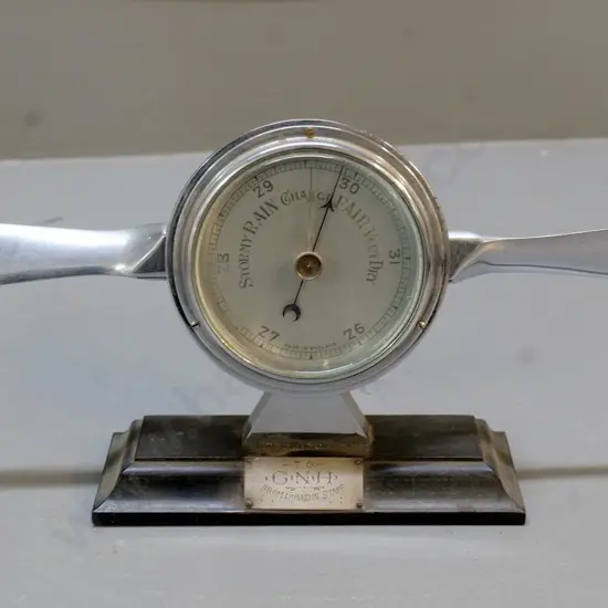 barometer made in England with aeroplane propeller theme and gift plaque for "GNH from Dunedin Staff" H-150 W-340