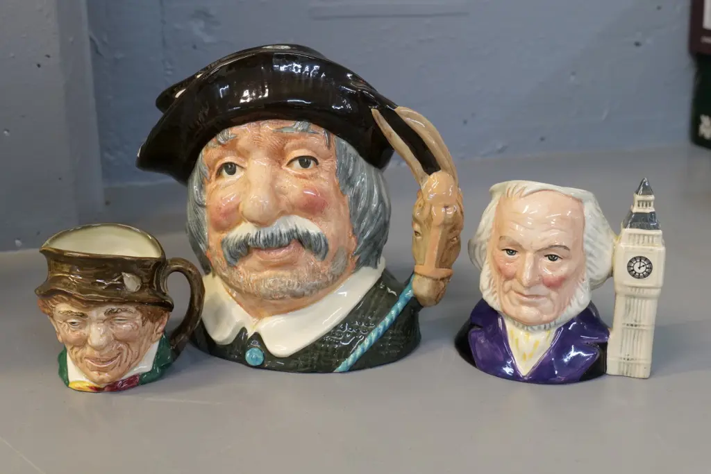 3 Royal Doulton toby jugs - large Sancho Panca H-200, smaller John Doulton, one other Image 1++