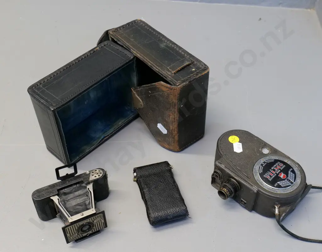 Bell & Howell Filmo 8mm cine camera & a small Ensign Midget Model 22 camera, bellows need repair - both w/leather cases Image 1++