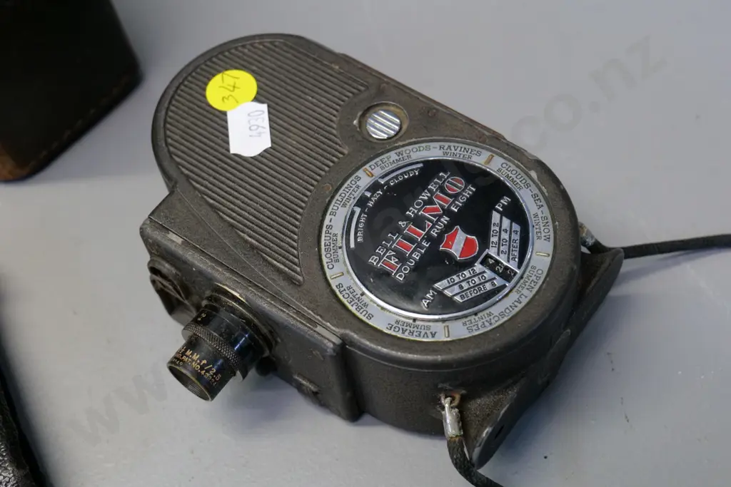 Bell & Howell Filmo 8mm cine camera & a small Ensign Midget Model 22 camera, bellows need repair - both w/leather cases Image 1++