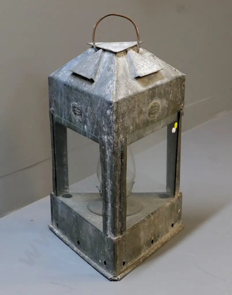 large triangular tin kerosene lantern, 2 plaques with "W Foster Sanitary Plumber Dunedin S" - chimney cracked H530 W300 Image 1++
