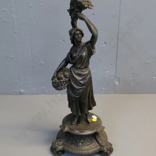 cast metal figural candle holder H440