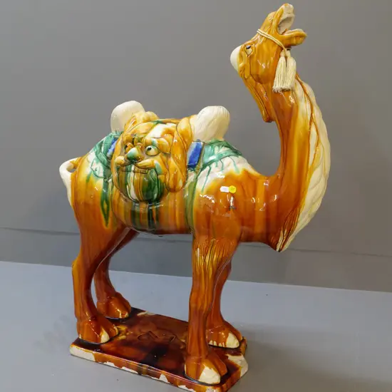 large ceramic camel with brown, cream and green trickle glaze - glaze chips all around base. H700 L600