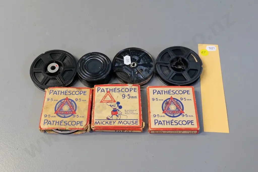 4 Pathescope 9.5mm film reels, including 1 Mickey Mouse, 2 8mm home movies and one small 16mm reel Image 1++