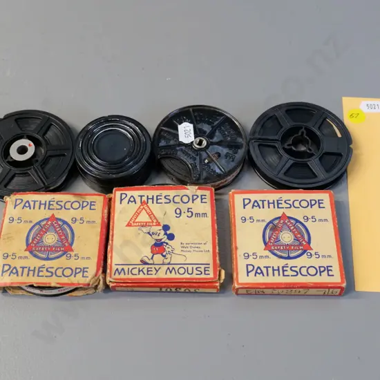 4 Pathescope 9.5mm film reels, including 1 Mickey Mouse, 2 8mm home movies and one small 16mm reel