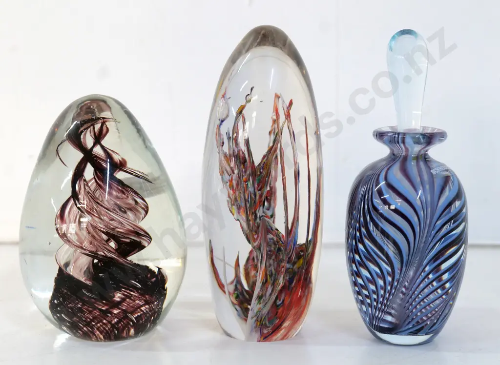 art glass items - Schroders NZ bottle (stopper stuck in place) and 2 paperweights, no maker's marks, taller is H150 Image 1++