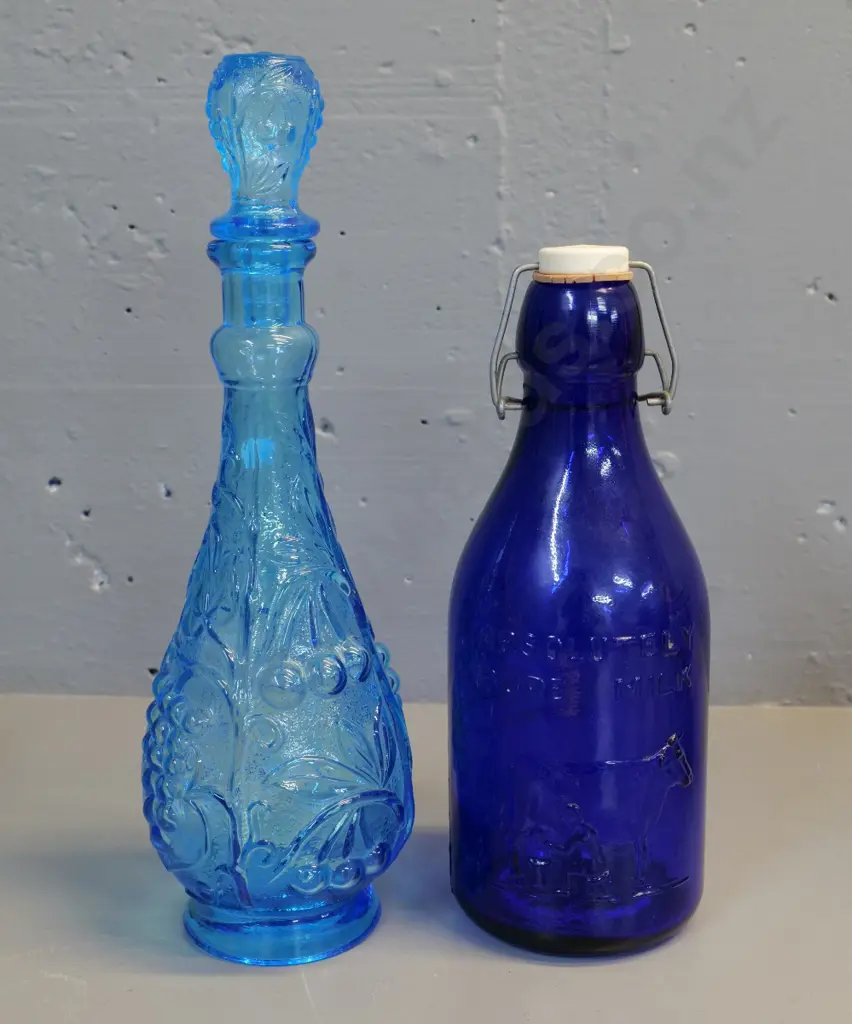blue stoppered genie bottle H350 (no stopper liner) and a reproduction 1 quart cobalt blue milk bottle (Made in Italy) Image 1++