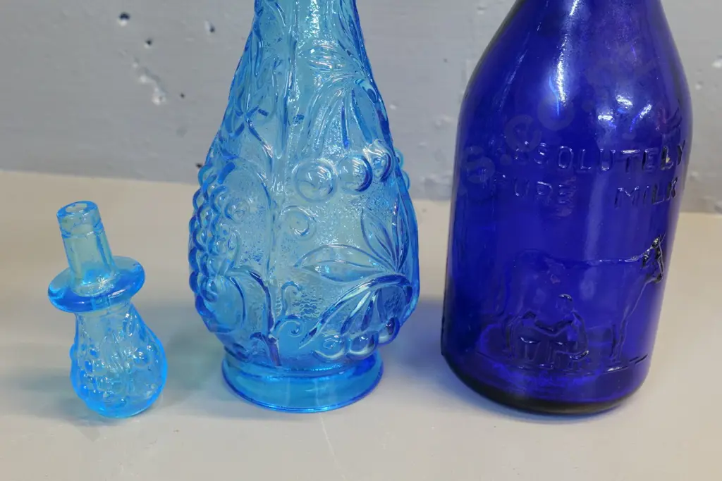 blue stoppered genie bottle H350 (no stopper liner) and a reproduction 1 quart cobalt blue milk bottle (Made in Italy) Image 1++