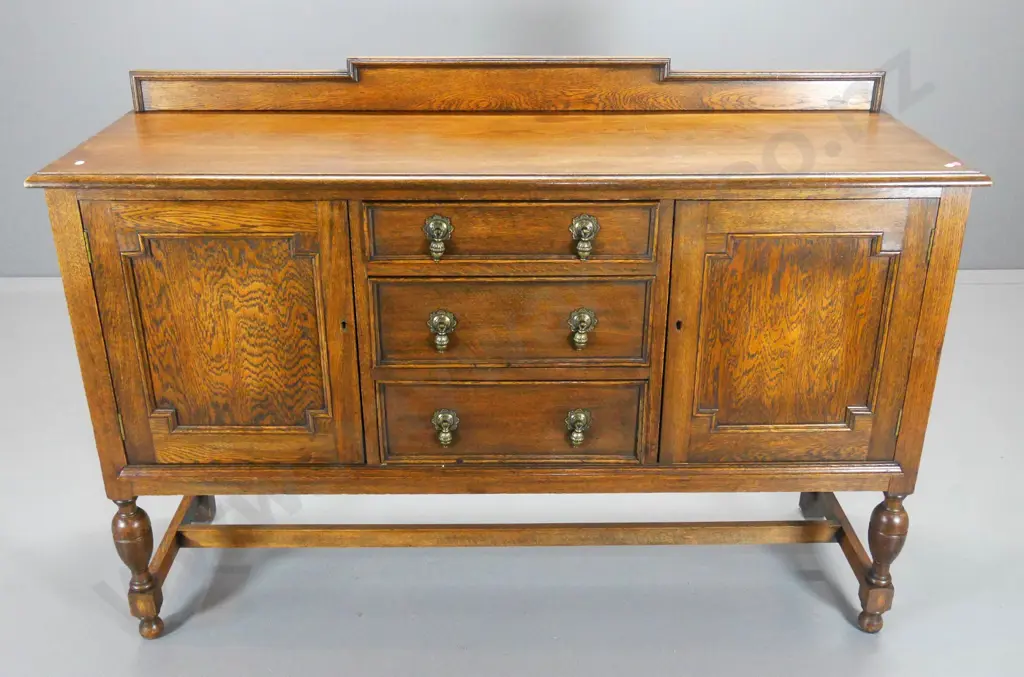 deco oak sideboard w/brass drop handles, 2 doors, 3 drawers, 1 has cutlery dividers, escutcheons & keys H1020 W1450 D470 Image 1++