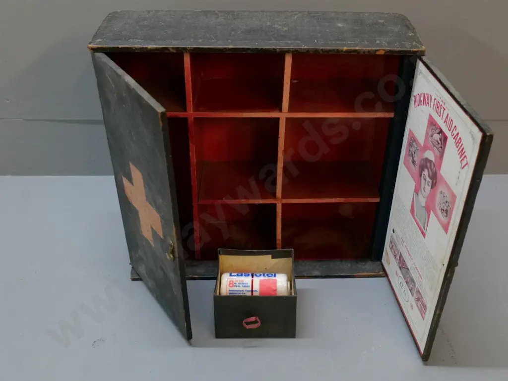 vintage wooden first aid cabinet with small metal catch - made by Ridgway, wear & tear, 1 printed paper panel missing Image 1++