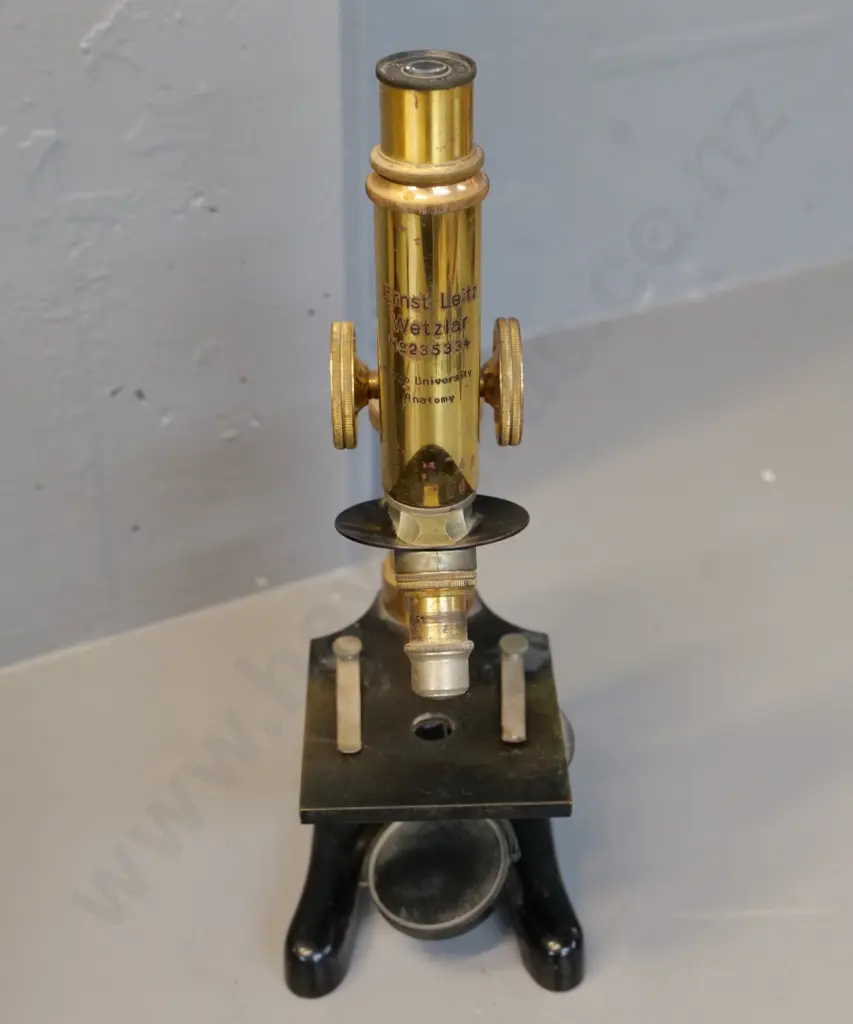 brass microscope marked Ernst Leitz Wetzlar and Otago University Anatomy with 2 lenses & objective; some surface pitting Image 1++