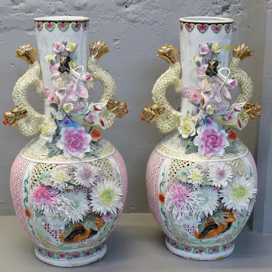 pair of large ornate Chinese vases w/dragon handles & elaborate applied flowers & figures, minor chips H560 W250