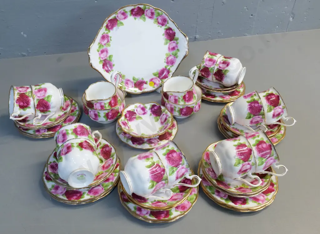 Royal Albert Old English Rose tea set - 12 trios, sweet dish, 2 creams and sugars - one cup is a different shape Image 1++