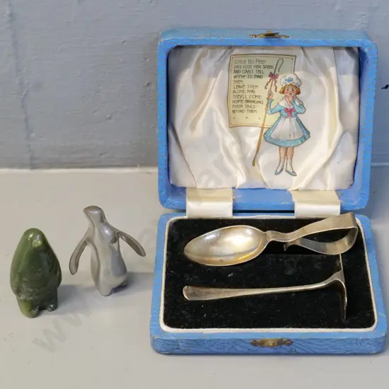 small signed Roush pewter penguin, small green stone penguin, cased sterling silver infant's spoon and pusher set