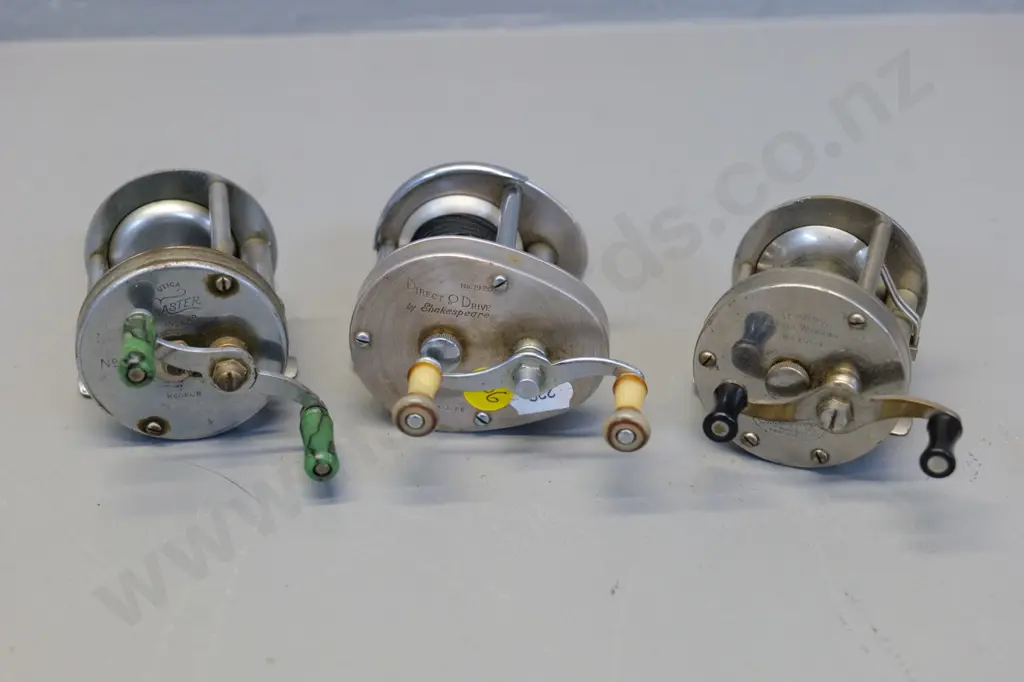 3 small metal fishing reels - Shakespeare Direct Drive, Utica Caster, Shakespeare Triumph Image 1++