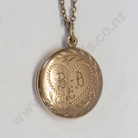 gold round locket engraving on front no mark