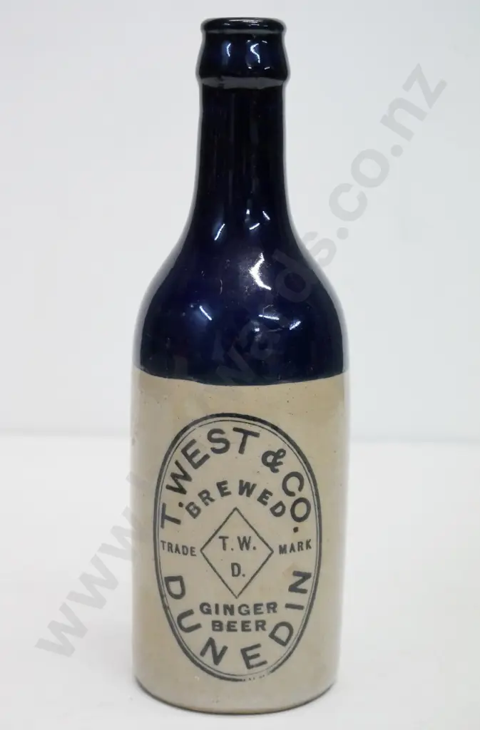 Ginger beer, crown cap, T West and Co, Dunedin, condition poor, has been filled at back, H - 210 Image 1++