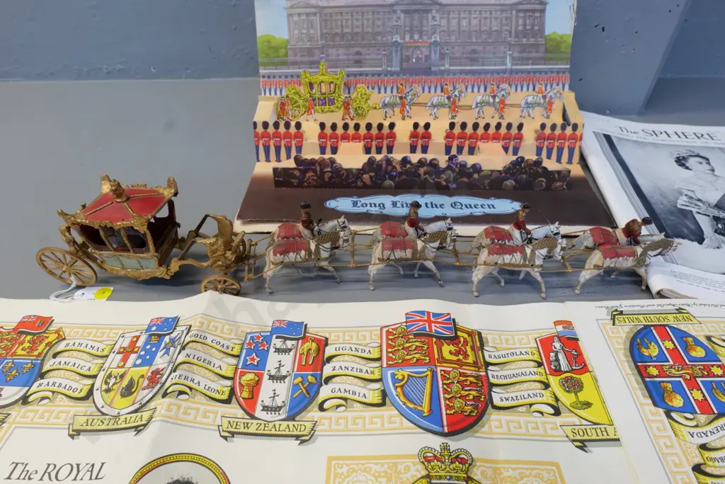 1953 coronation items - cast metal model carriage set (roof loose) pop-up diorama book, clippings, etc. Image 1++