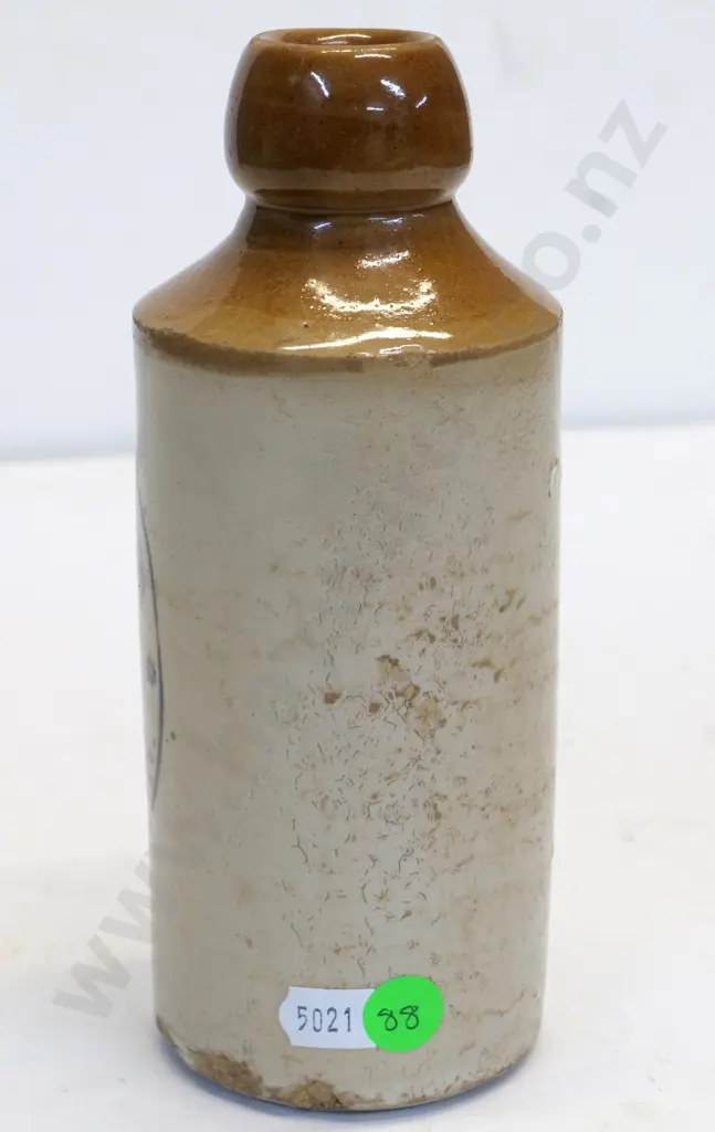 Dumpy ginger beer bottle, Lanes Ltd Dunedin, condition poor, chips to base, H - 170 Image 1++