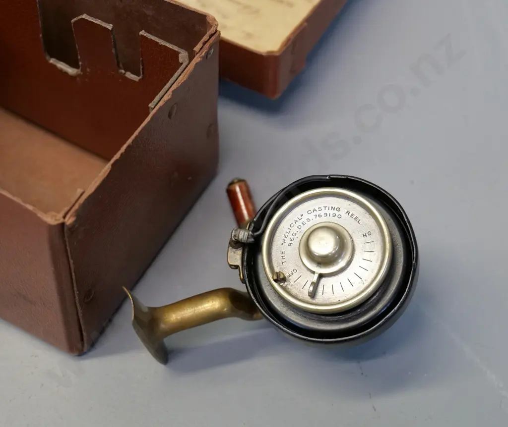 cased metal fishing reel - marked The Helical Casting Reel Co. Redditch Image 1++