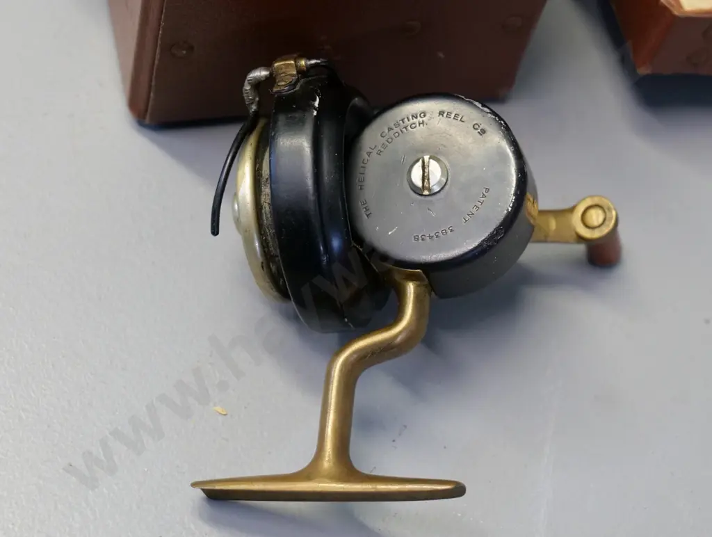 cased metal fishing reel - marked The Helical Casting Reel Co. Redditch Image 1++