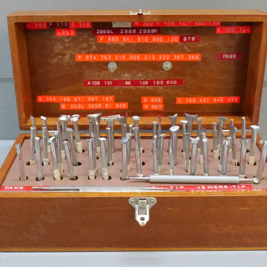 wooden case with numerous leather embossing tools, most seem to be in unused condition - case H120 W320 D150