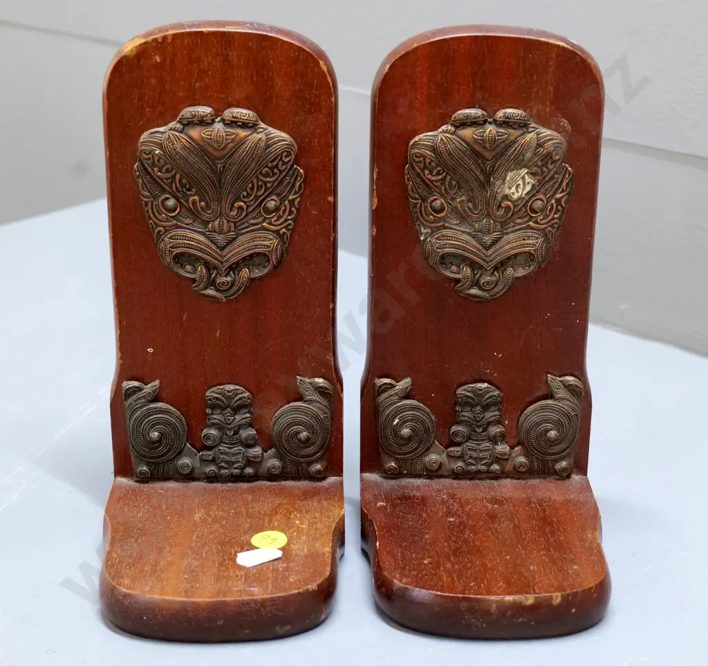 pair of wooden book-ends with metal Maori motif decoration, Kingsley Giftware label. Wear to finish H-210 Image 1++