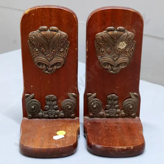 pair of wooden book-ends with metal Maori motif decoration, Kingsley Giftware label. Wear to finish H-210