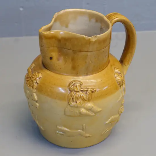 two-tone beer jug with raised figures H-200 - no maker's mark, small chips around rim