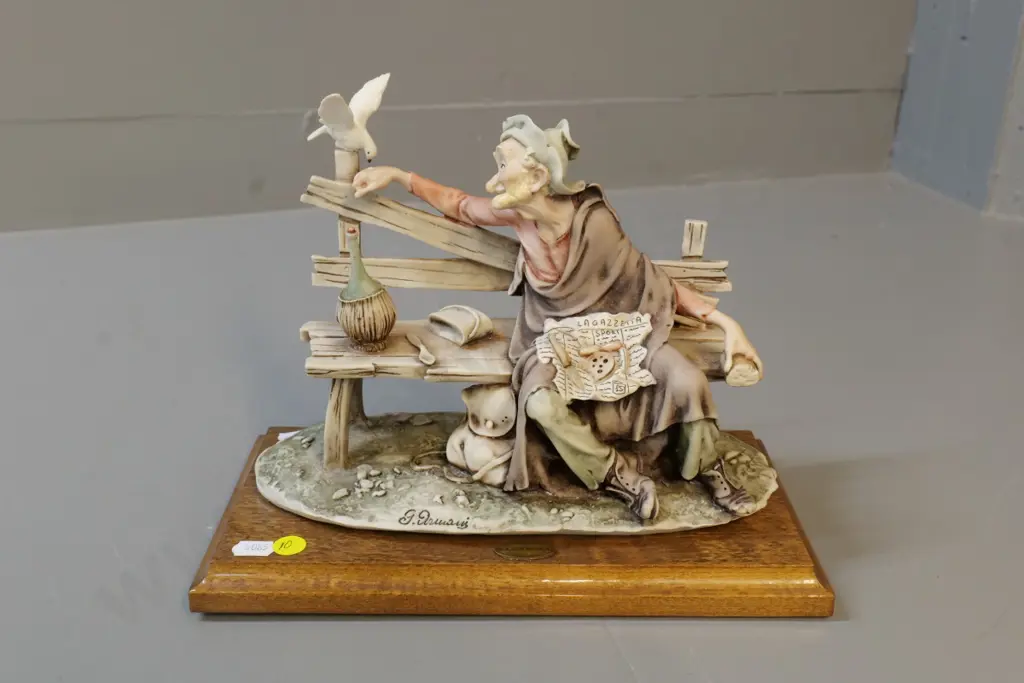 composite figurine on wooden base - man feeding pigeon - marked G. Armani H200 L260 Image 1++