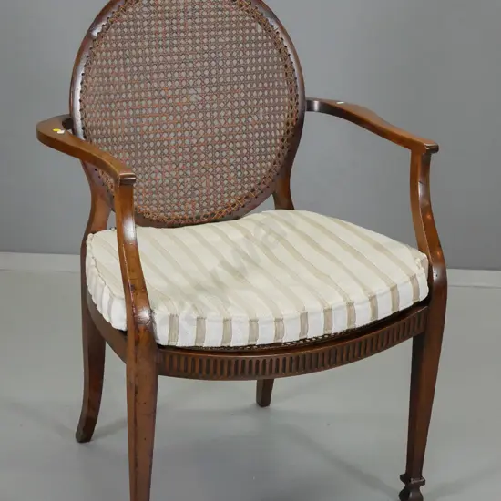 mahogany regency-style elbow chair w/bergere cane back, striped chenille velvet seat, some damage to cane H940 W670 D490